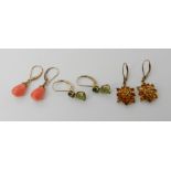 Three pairs of 9ct gold gem set earrings to include peridot, citrine and coral, weight combined 7.