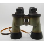 A pair of military binoculars with rubber lens guards, no markings Condition Report: Available