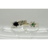 A 9ct emerald and diamonds flower ring size M and a 9ct white gold retro sapphire ring size M,
