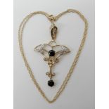 A 9ct gold sapphire and diamond Edwardian style pendant, length 4.6cm, length of chain 40cm,