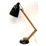 A wood and metal desk lamp Condition Report: Available upon request