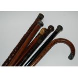 Six various walking canes including a silver-topped example (6) Condition Report: Available upon
