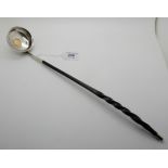 A George III toddy ladle with coin set white metal bowl and whalebone handle, 43cm long Condition