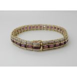A 9ct diamond and pink gem set bracelet, matching pendant at lot 7, length of bracelet 18.3cm,