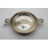 A silver quaich, London 1945, of classic form, the lugs with stylised dragon decoration, 26cm across