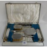 A cased six piece silver backed dressing table set, Birmingham 1940 Condition Report: Available upon