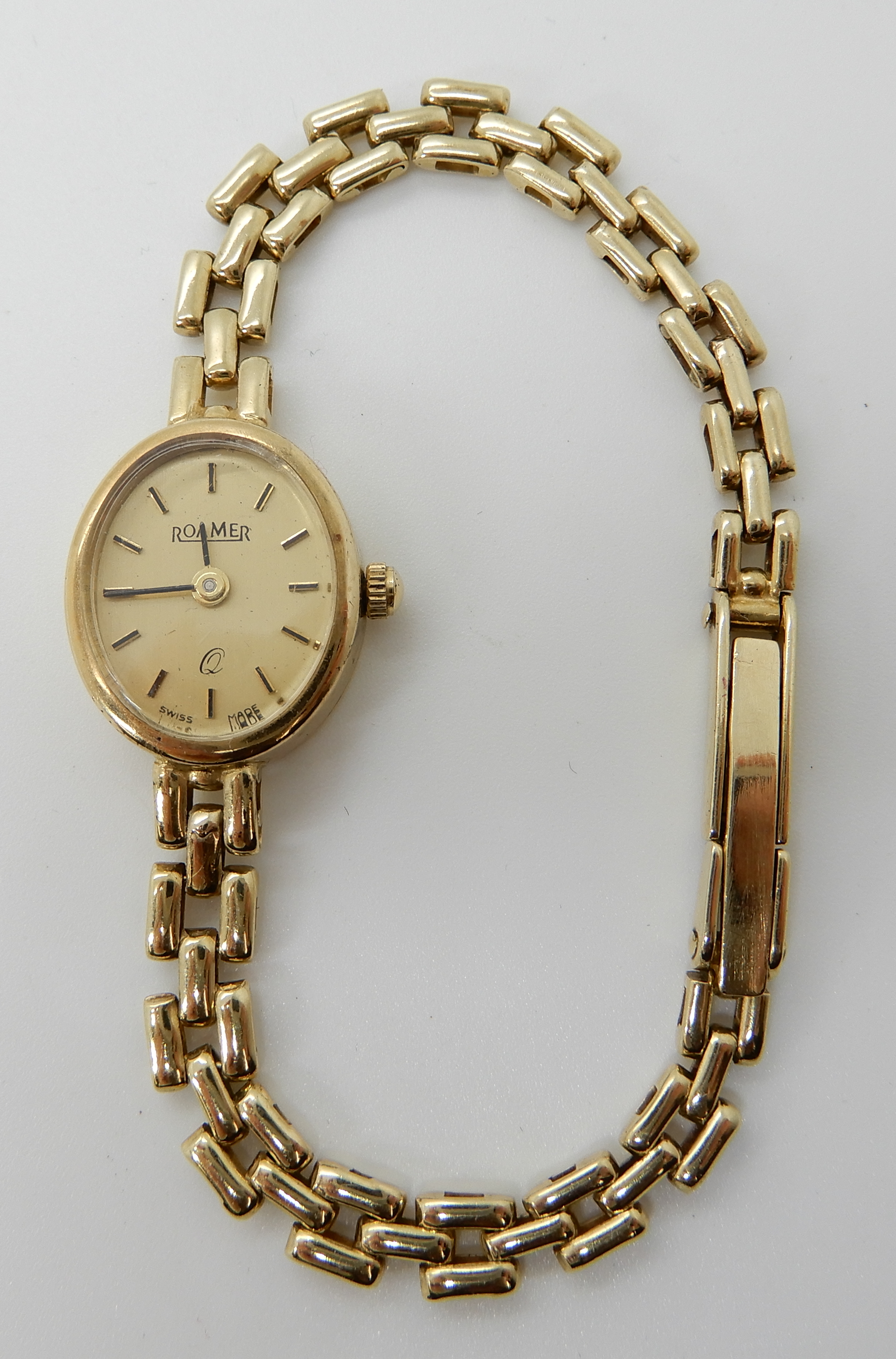 A 9ct gold Roamer ladies wristwatch with oval dial, weight including mechanism 11.8gms Condition