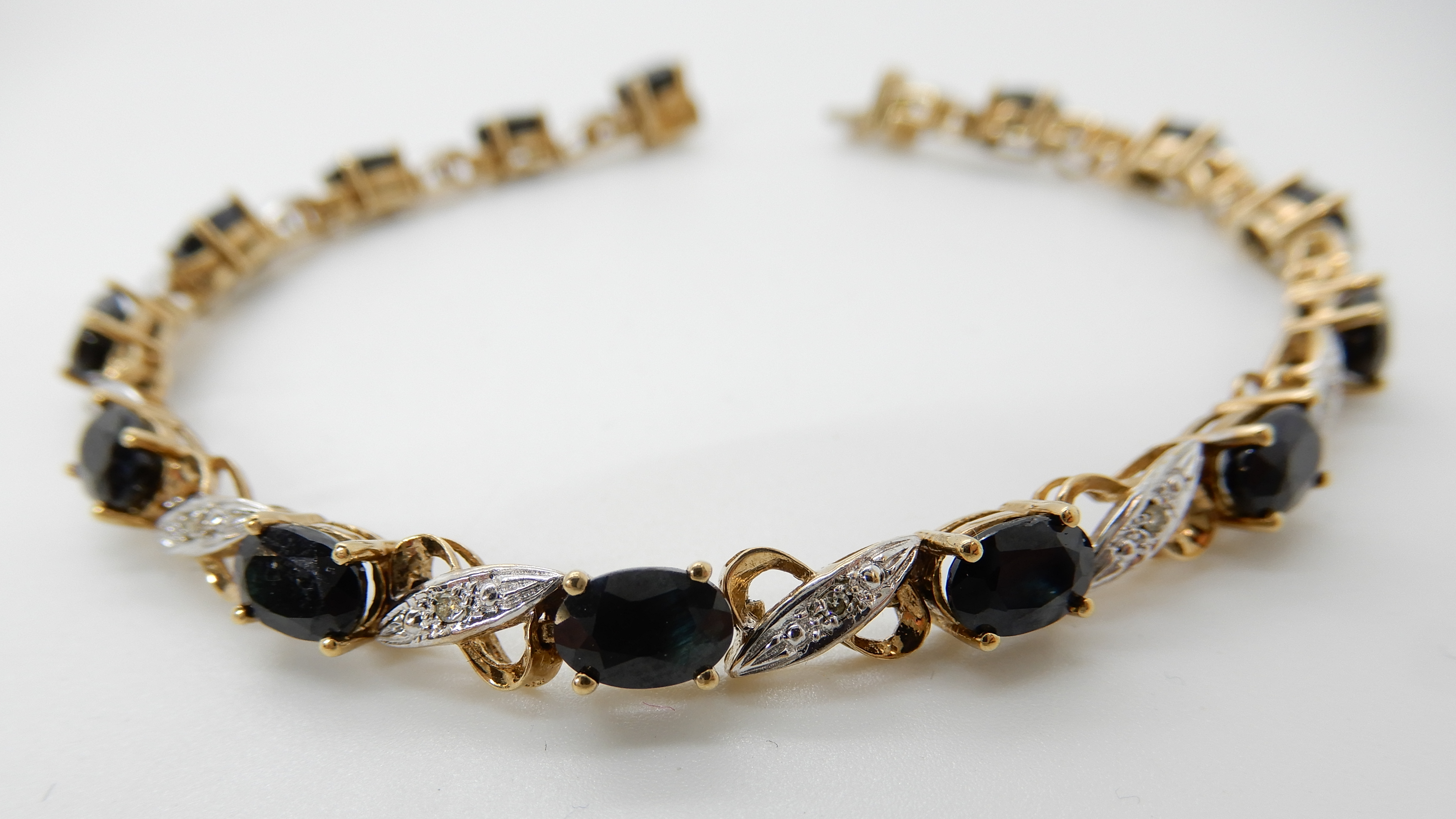 A 9ct gold sapphire and diamond accent bracelet, length 18cm, weight 9.6gms Condition Report: - Image 2 of 3