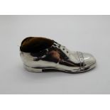 A silver pin cushion modelled as a lace-up shoe, Birmingham 1918, 12.5cm long Condition Report: