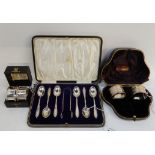 A lot comprising a cased set of six silver teaspoons and sugar tongs by Elkington and Co