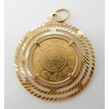 An Arabic gold coin in yellow metal mount stamped 750, diameter of the coin 2.2cm, pendant 3.6cm,