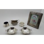 A lot comprising a pair of silver octagonal tazza Sheffield 1921, a silver photograph frame, odd