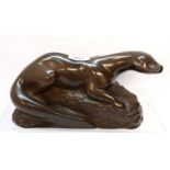 A bronzed resin figure of an otter Condition Report: Available upon request