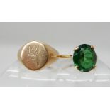 A 9ct ring set with a green glass gem size K1/2, a 9ct gold signet ring size L1/2, combined weight