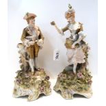 A pair of candelabra bases each modelled with a figure in 18th Century dress Condition Report: