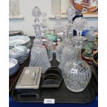 A pair of Tudor crystal bell shape decanters, three other decanters, a cigarette box and a Deco