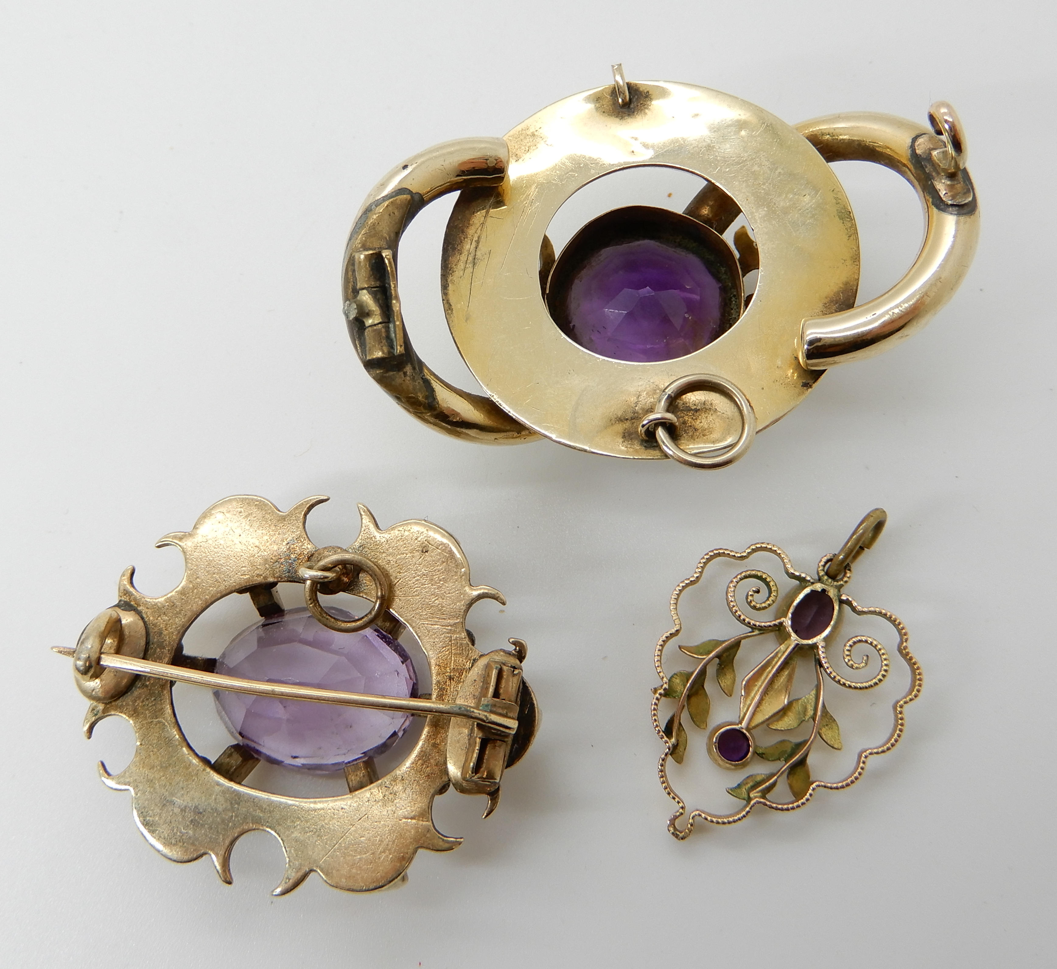 Two yellow metal amethyst set brooches and a pendant, weight 20.5gms Condition Report: Available - Image 2 of 2