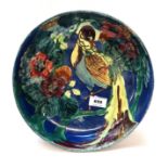 A Thomas Forrester and Sons Trogonware bowl decorated with a bird amongst flowers, 27.5cm