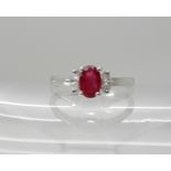 An 18ct white gold ruby and diamond ring, dimensions of the ruby 5.9mm x 4mm x 3.1mm, with marquis