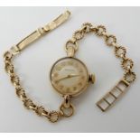A 9ct gold ladies Movado wristwatch, weight including mechanism 14.6gms Condition Report: