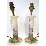 A pair of Moorcroft apple blossom pattern candlestick table lamps Condition Report: Crazing to