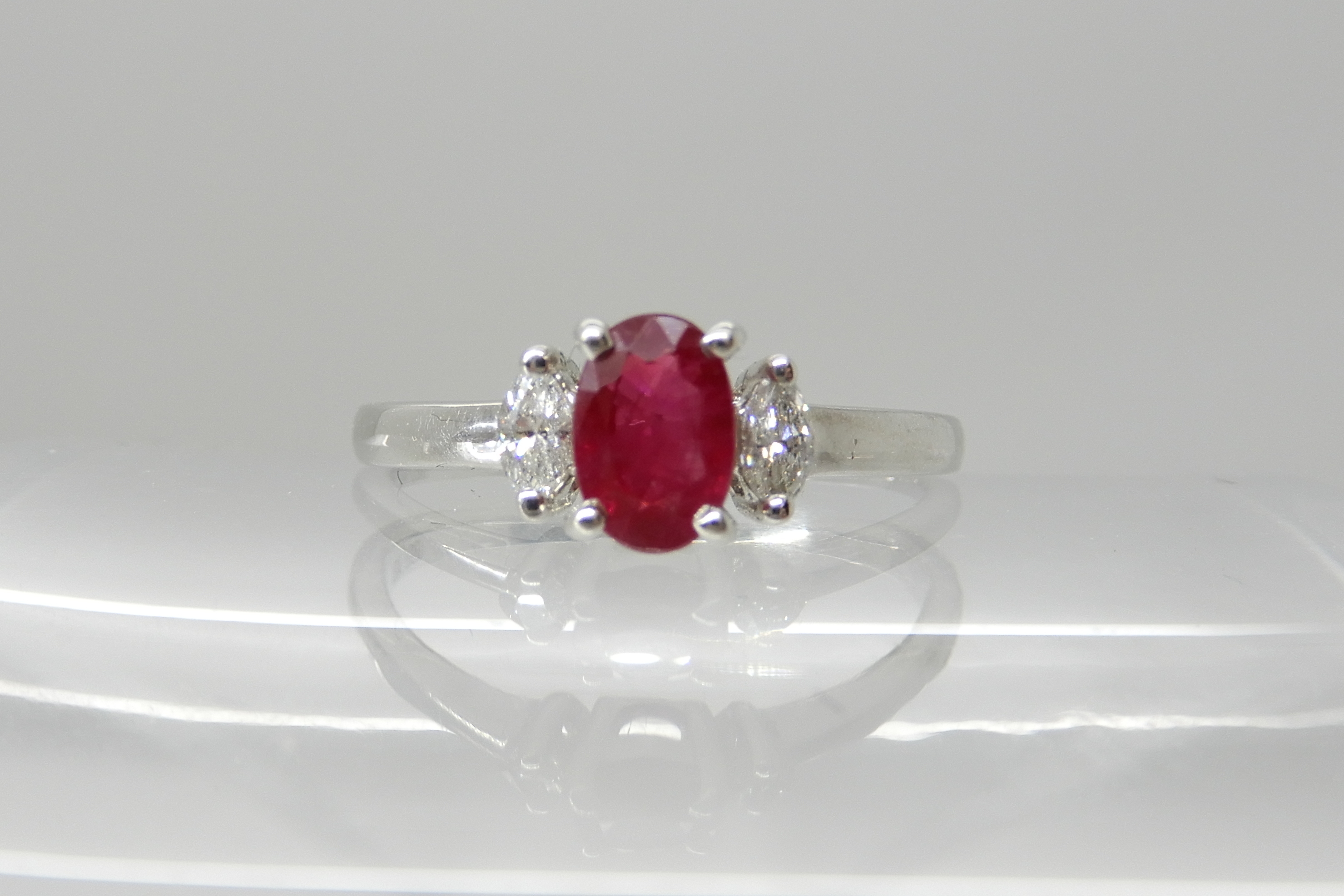 An 18ct white gold ruby and diamond ring, dimensions of the ruby 5.9mm x 4mm x 3.1mm, with marquis - Image 3 of 4