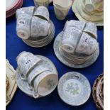 A Wedgwood bone china tea set decorated with flowers comprising eleven plates and cups, twelve