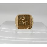 A yellow metal signet ring stamped 750, size M1/2, weight 8.2gms Condition Report: Available upon