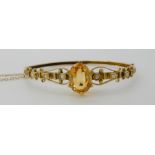 A YELLOW METAL CITRINE AND PEARL SET BANGLE citrine approx 12mm x 9.6mm x 7.2mm, inner dimensions