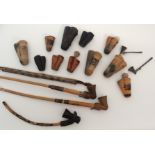 A GROUP OF AFRICAN PIPES comprising; Northern Cameroons clay pipes, 6 to 10cm high, with stems,