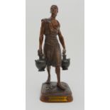 A FRENCH BRONZE FIGURE OF A MAN modelled carrying two jars, bears plaque inscribed 'Prix de Rome',