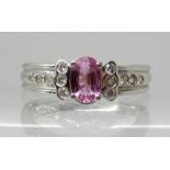 AN 18CT WHITE GOLD PINK SAPPHIRE AND DIAMOND RING the pink sapphire measures 5.7mm x 3.8mm x 2.