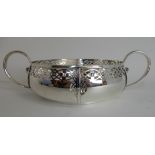 A SILVER FRUIT BOWL by E. S. Barnsley & Company, Birmingham 1913, of shallow circular form with