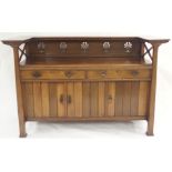 AN OAK ARTS AND CRAFTS SIDEBOARD with a dentil shelf over a pierced floral back panel and X-frame