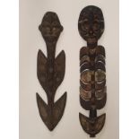 FOUR AFRICAN PAINTED WOOD CARVINGS each with shell eyes and three with pigment decoration, 72 to