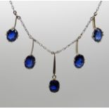 A FIVE SAPPHIRE DROP NECKLACE made in yellow and white metal, the three main sapphires measure