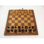 AN EBONY AND BOXWOOD STAUNTON CHESS SET with weighted bases, in original box, King 10cm high with