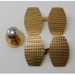 A PAIR OF 18CT GOLD CUFFLINKS AND A DIAMOND SET STUD with all over engine turned decoration, with