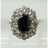 AN 18CT GOLD SAPPHIRE AND DIAMOND CLUSTER RING the central sapphire measures 8.4mm x 5.3mm x 4.