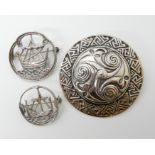 THREE SCOTTISH SILVER BROOCHES a large shield shaped brooch by Hamish Dawson Bowman with Celtic
