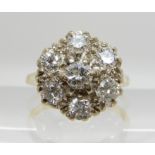 AN 18CT GOLD DIAMOND FLOWER RING set with estimated approx 1.15cts of brilliant cut diamonds. finger