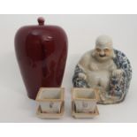 A CHINESE SANG DE BEOUF JAR AND COVER 32 cm high, blue and white smiling buddha, 25cm high and a