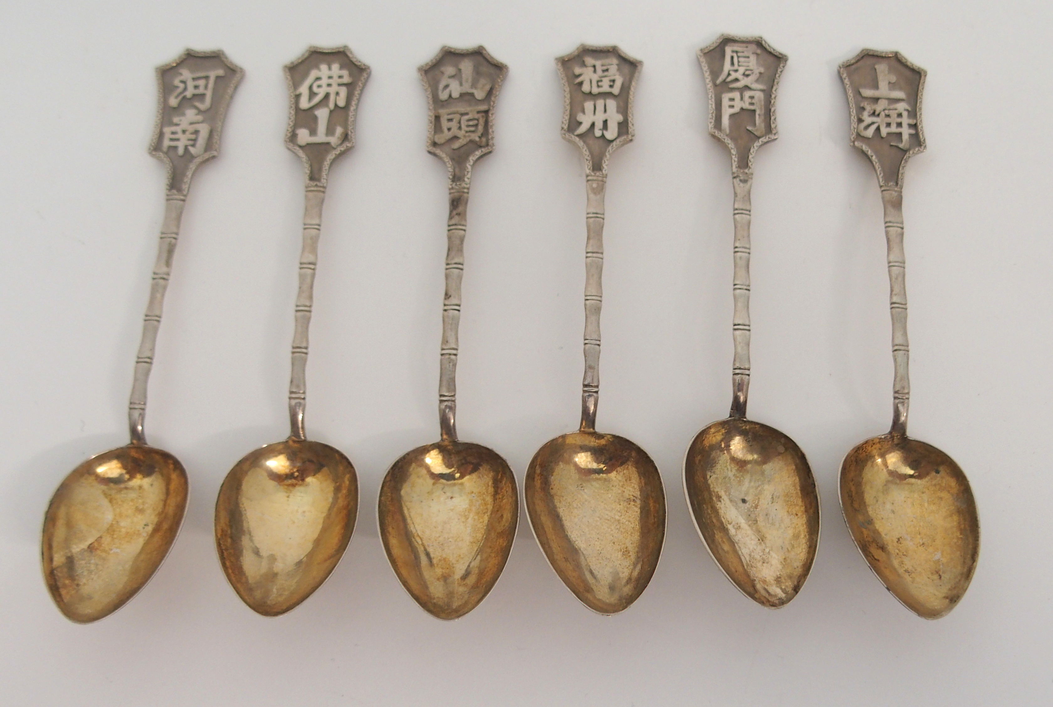 A SET OF SIX CHINESE EXPORT SILVER TEASPOONS with calligraphy on faux bamboo stems, stamped marks,