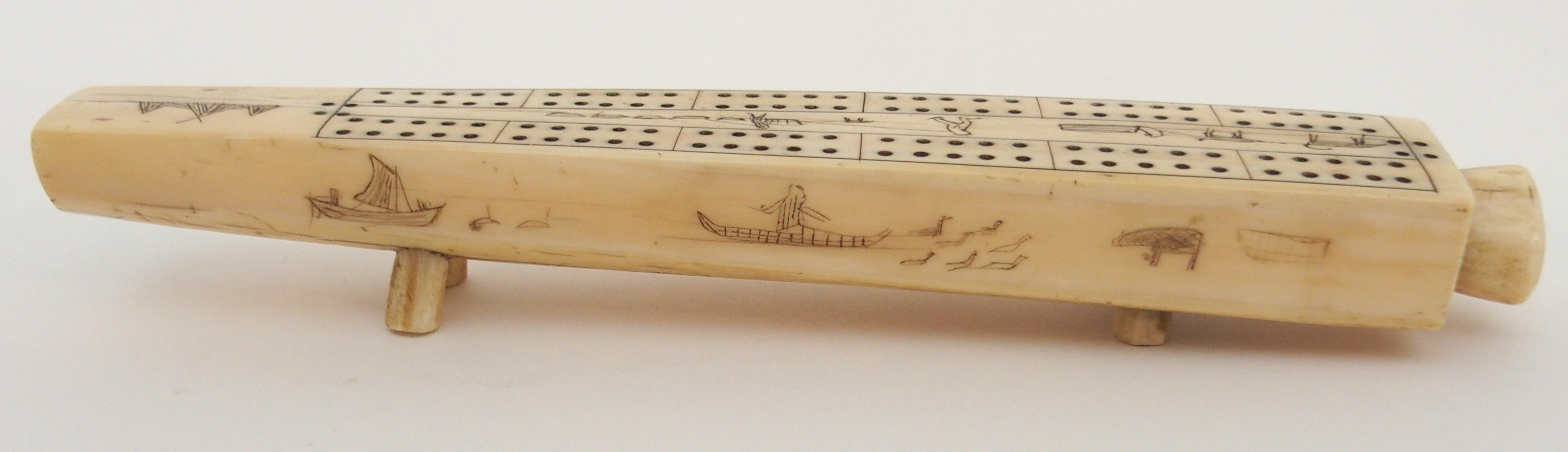 AN INUIT WALRUS TUSK CRIBBAGE BOARD the top with twelve pierced marker sections, divided by Eskimos, - Image 5 of 6