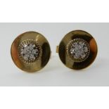 A PAIR OF 14KT DIAMOND SET CUFFLINKS set with a rondel of eight cut diamonds, estimated approx 0.