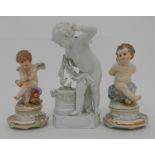 A PAIR OF MEISSEN CHERUB FIGURES one modelled with hands and wings bound, pattern no 104, 11cm high,