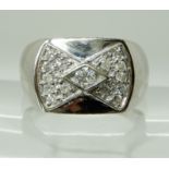 A GENTS 9CT WHITE GOLD DIAMOND RING with diamond pave set area with combined estimated approx