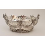 A SILVER BASKET by C. S. Harris & Sons Limited, London 1912, of oval form, the open strapwork body