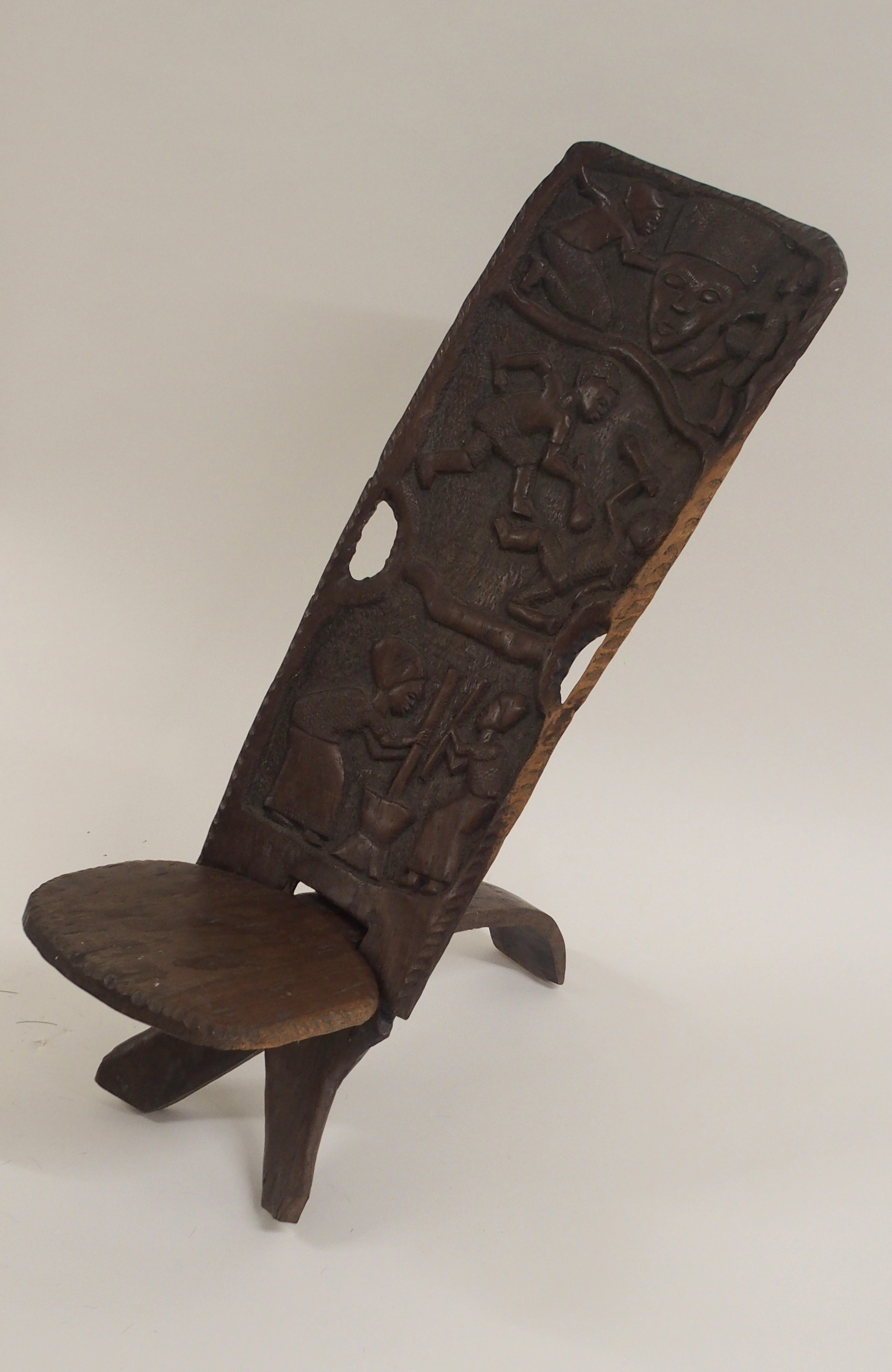 AN AFRICAN CARVED BIRTHING CHAIR the back with face mask flanked by two figures, above two women - Image 8 of 11