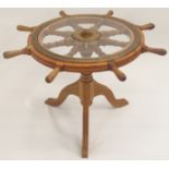 AN OAK AND BRASS MOUNTED SHIPS TELEMOTOR WHEEL WITH EIGHT SPINDLES the brass plate named